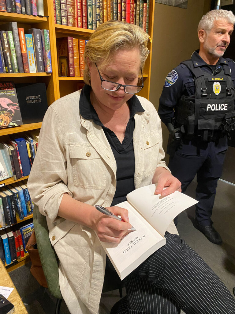 Elena Hartwell Taylor signs my newly purchased copy of her book, A Cold Cold World. An enjoyable evening and a good read ahead: both wins.
