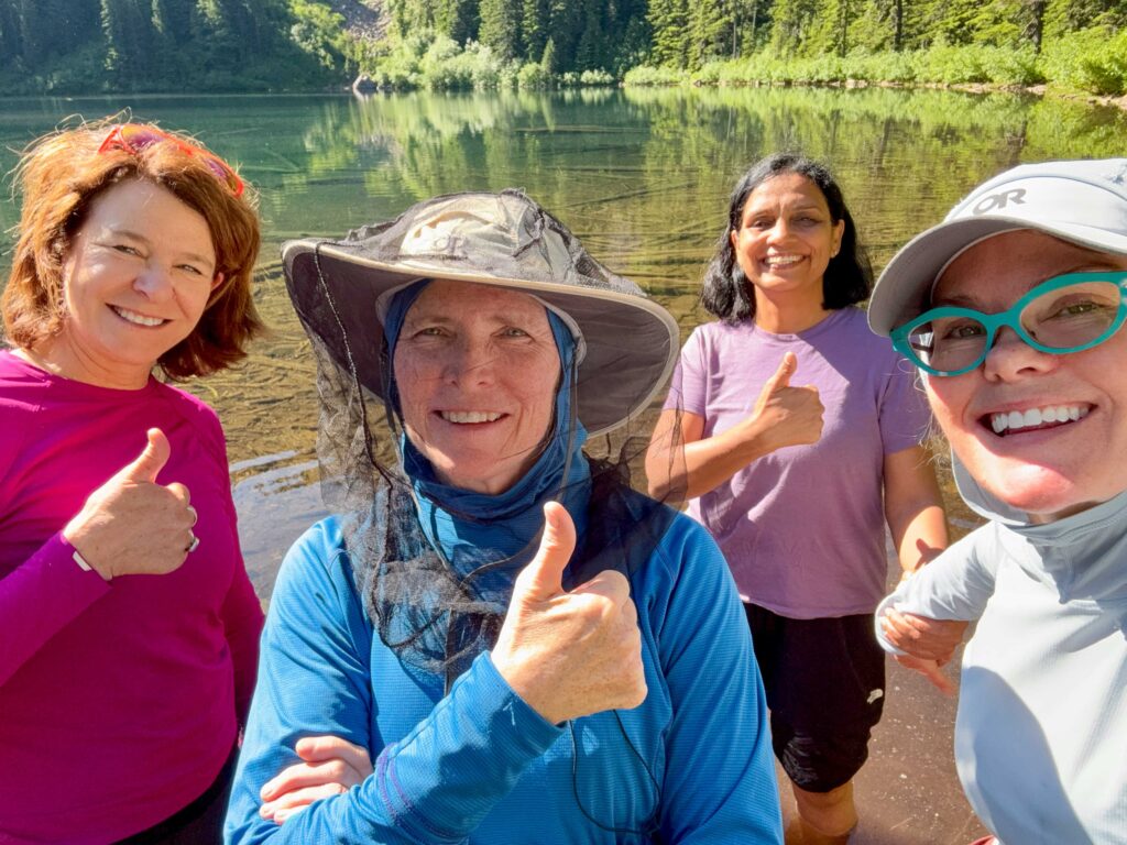 My solution to bugs: a head net draped over my hat and long sleeves / tights. Phone photo contributed by Darcy Barry.