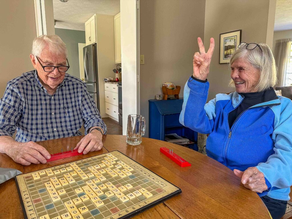 My mom showing the "V" for victory at 3-person Scrabble.