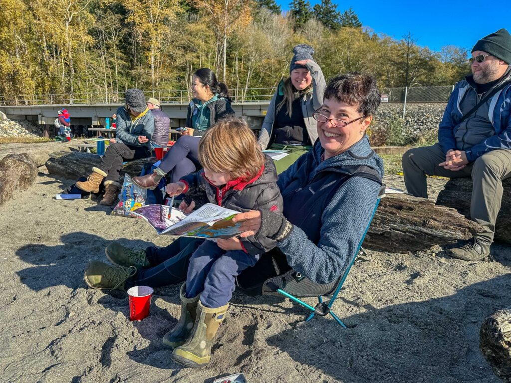 A young artist at work with Anna's support (her lap and makeshift easel!)