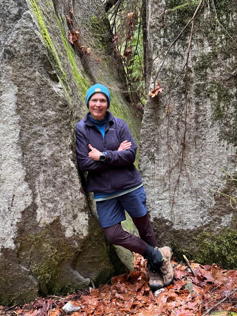 Rugged mountain woman, at her favorite split rock on the Big Creek / Otter Falls trail.