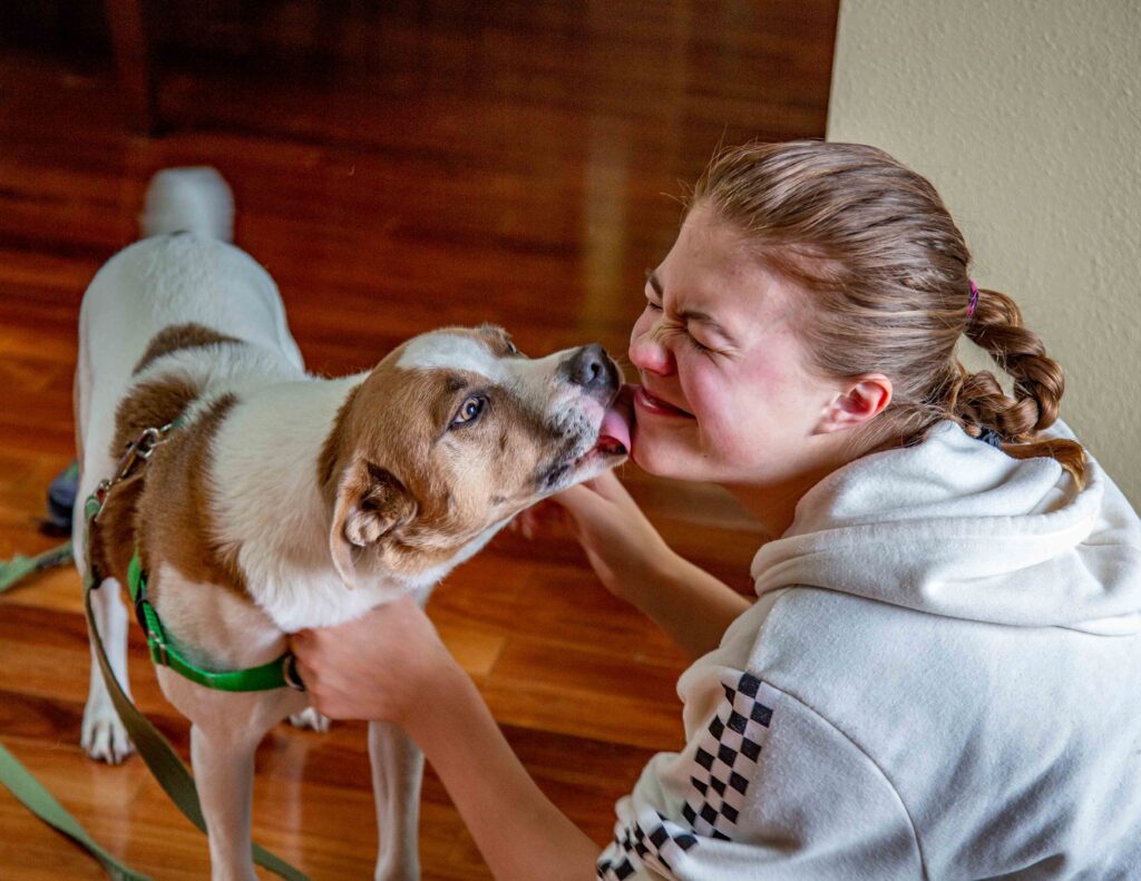 Doggy kisses on our daughter's 16th birthday.
