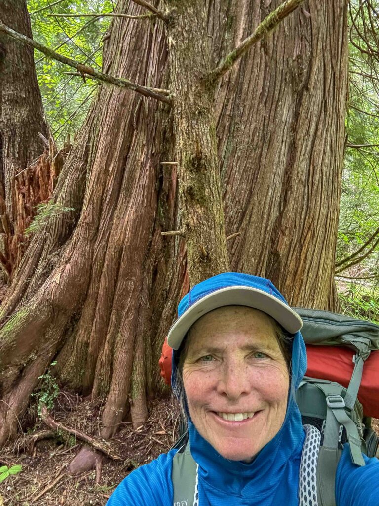 Backpacking togs in front of a massive old-growth cedar that wowed my socks off.