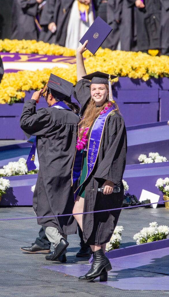 Stepping off the purple ramp into her future.