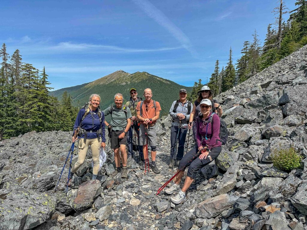 A strong group enjoying 11 miles on the PCT from Snoqualmie Pass to Windy Pass with Granite Lookout Tower behind us.