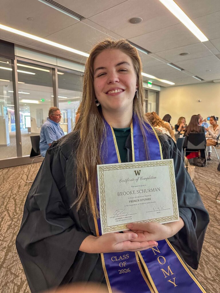 Our daughter proudly shows off her first of three certificates at the French and Italian Department Celebration.