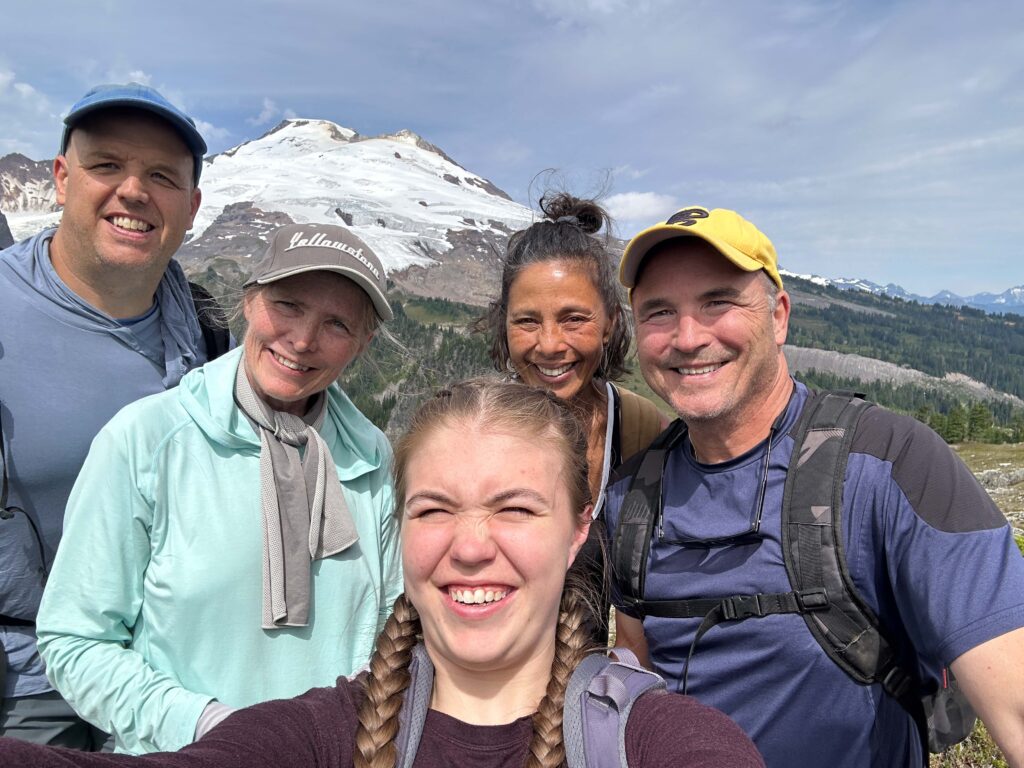 Happy hikers at Park Butte with breathtaking Mt. Baker in the background