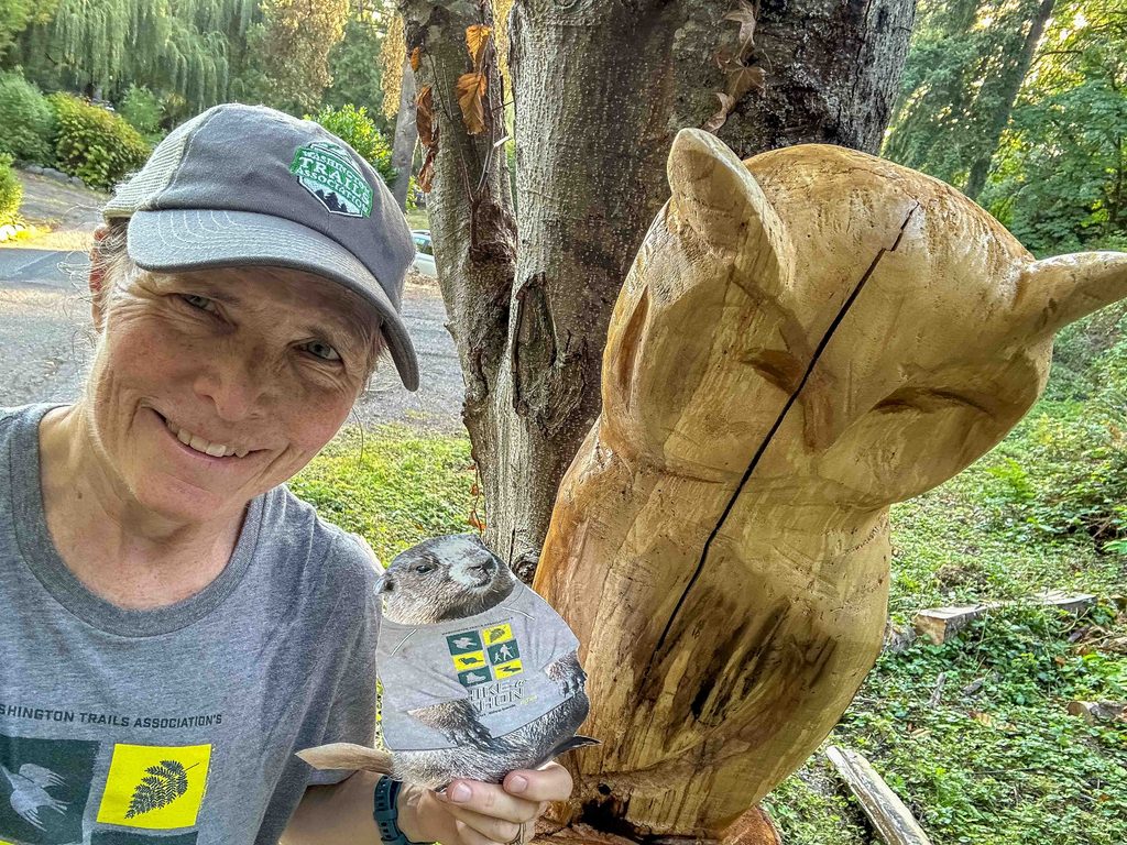 Selfie with Miles Marmot, my WTA hat and my WTA fundraising t-shirt for #Hikeathon 2026 during the month of August.